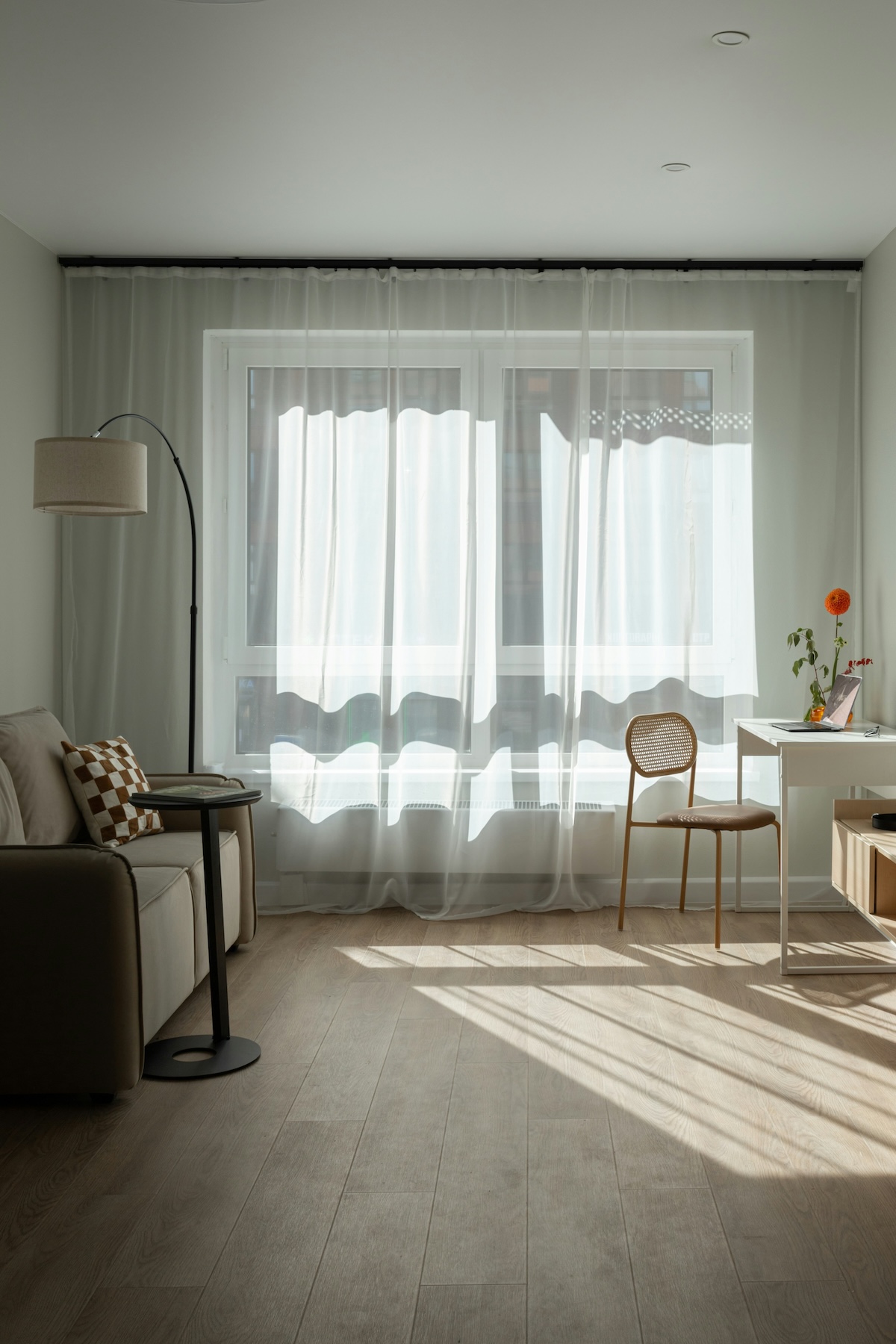 Soft sunlight streaming through windows into a quiet room