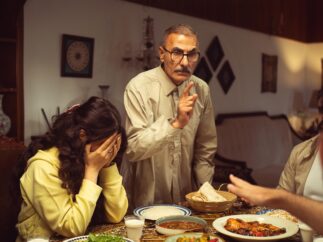 Betrayal in family relationships depicted through conflict among adult family members