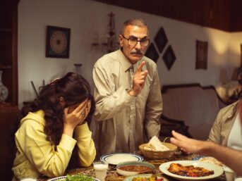 Betrayal in family relationships depicted through conflict among adult family members